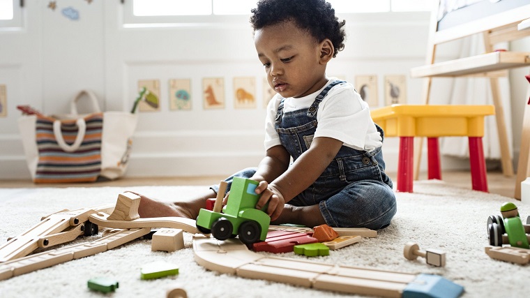 kid playing with Djeco Toys