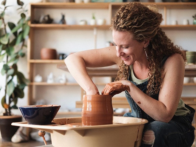 woman making modern pottery