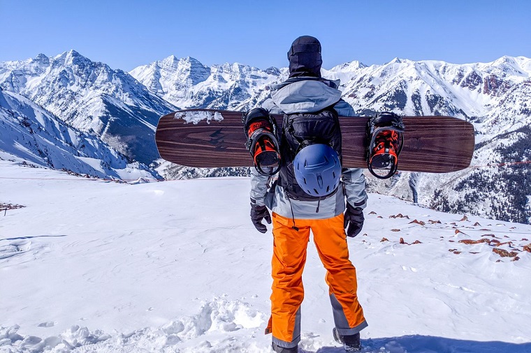 Snowboarder with snowboarding equipment