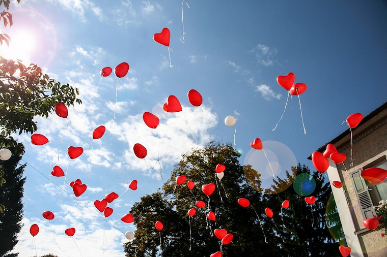heart balloons thrown in the air