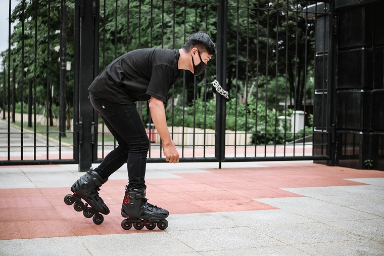 picture of a man with mask driving inline skates 