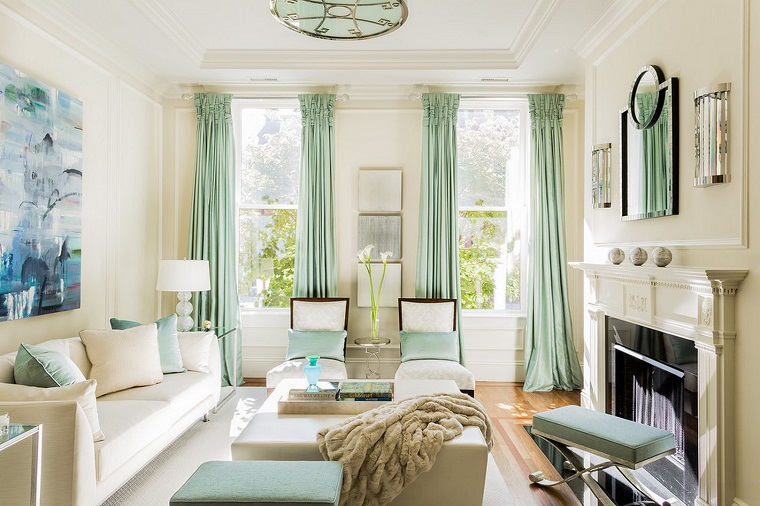 living room with teal curtains and beige wallpaper 