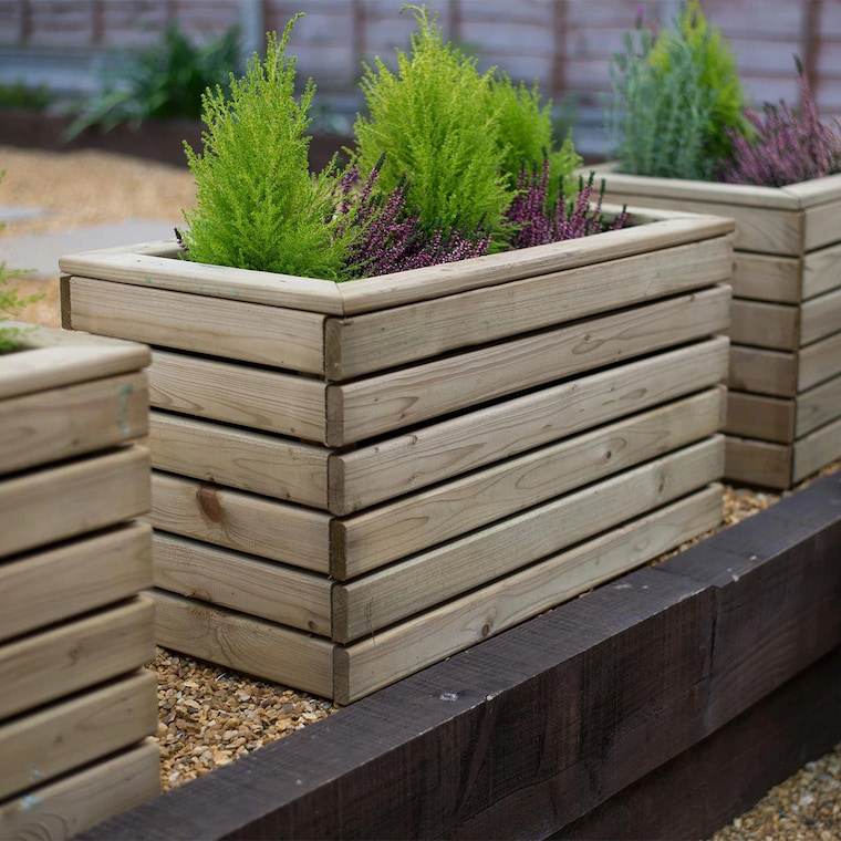 wooden planter with little trees