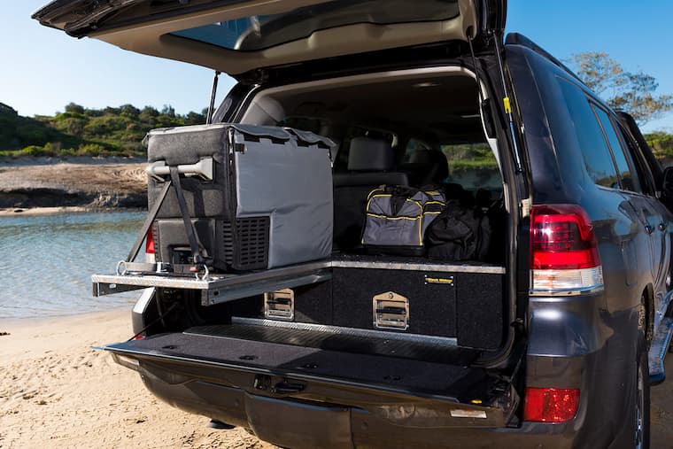 two -way portable camping fridge in the car