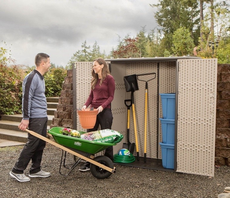 couple working in front of plastic garden shed