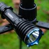 picture of an Olight flashlight on a fence