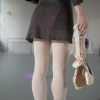 picture of ballerina holding a pair of ballet shoes