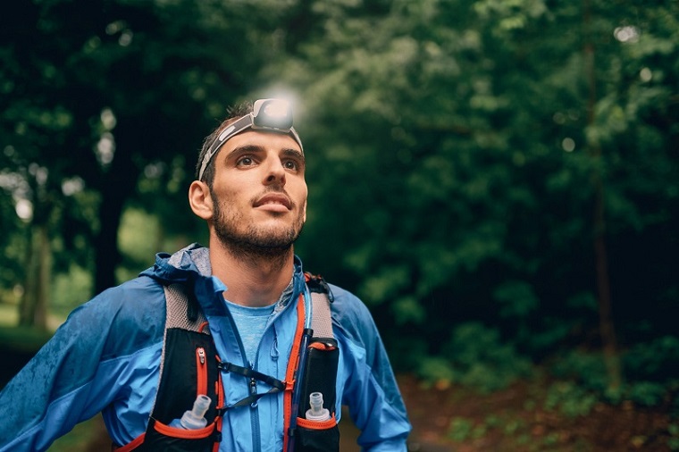 man using a headlamp