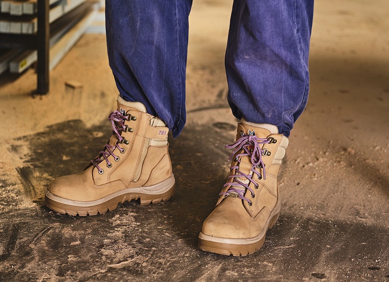 man wearing work boots at work