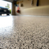 zoomed in floor in garage with epoxy coating background blurred out