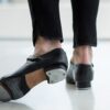 Close-up of dancer wearing tap shoes in the studio